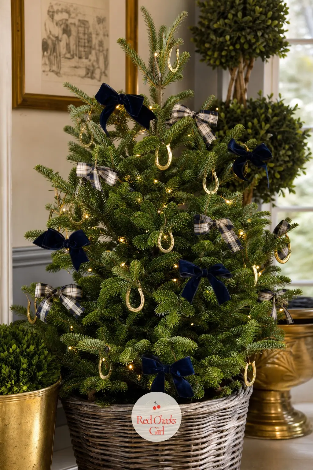 The Living Equestrian Spruce — A small spruce still rooted in its growing pot, this is the quiet counterpart to the full lodge tree, same brass-and-leather