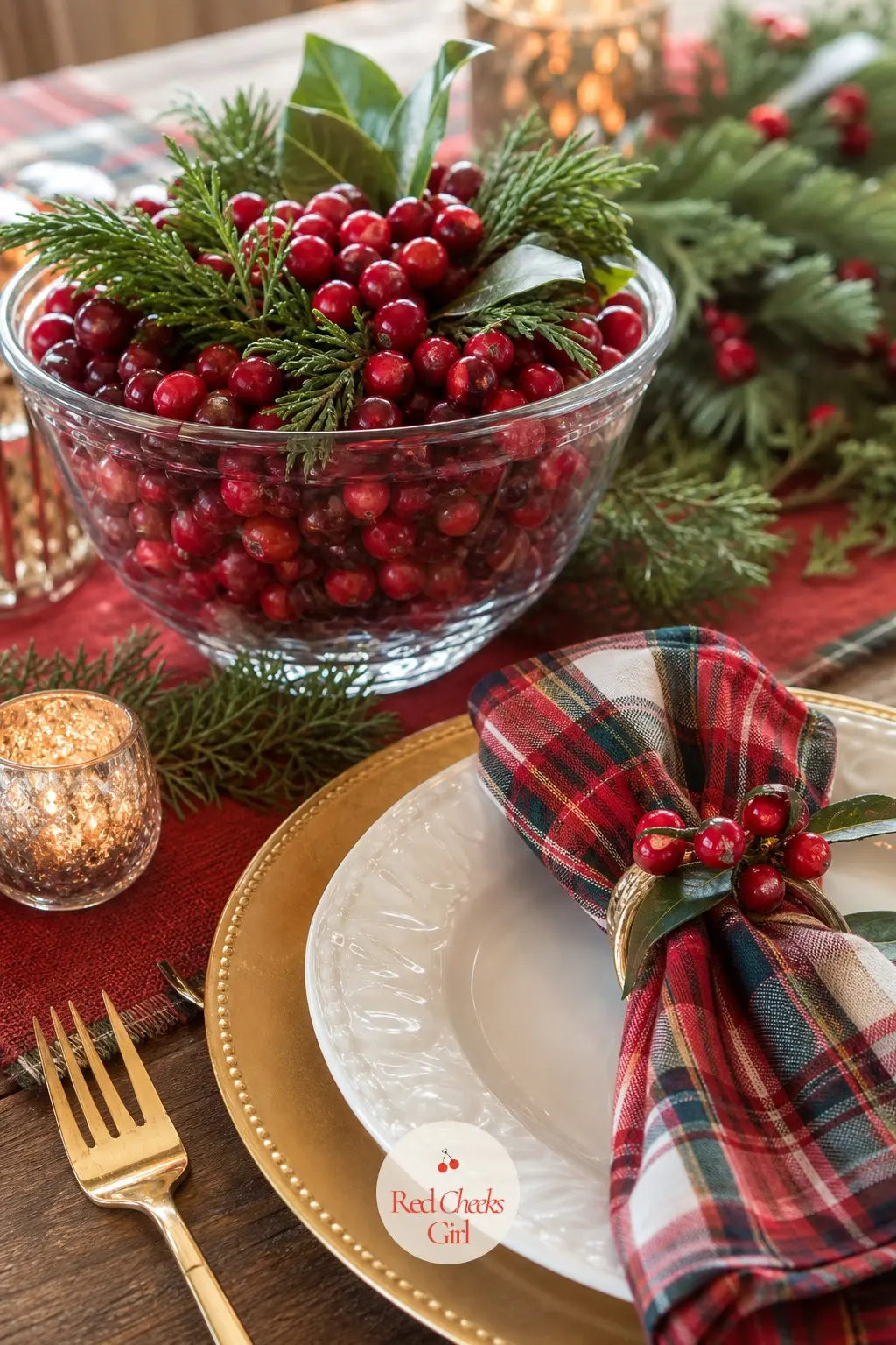 The Table, Set With a Cherry Centerpiece and One Place Setting — The table carries the most disciplined version of the palette: a glass bowl centerpiece filled