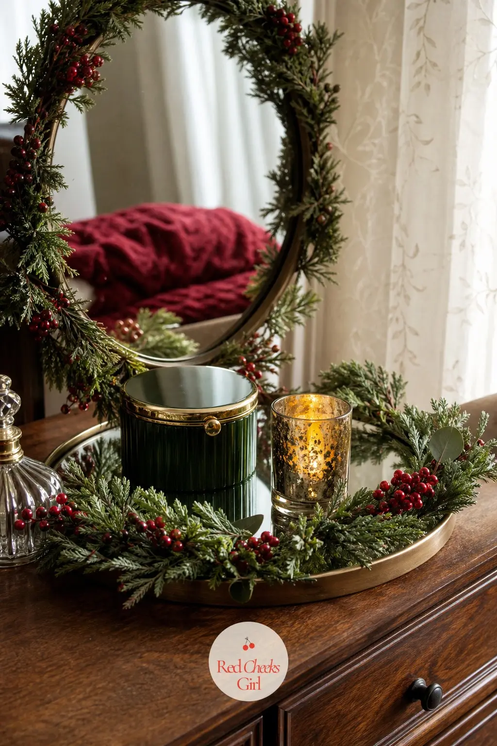 The Dresser Top, Set With a Small Wreath Mirror — A round mirror tray with a miniature wreath laid flat around its base, a jewelry box and a single votive, is