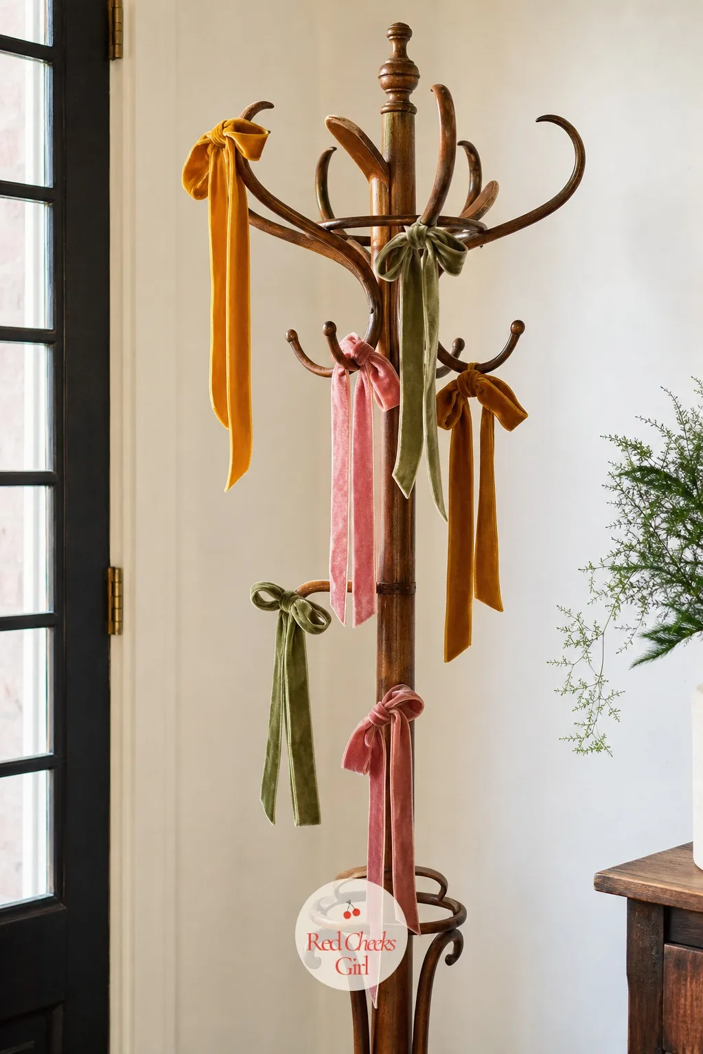 A Cluster of Velvet Bows Tied Along the Coat Rack by the Door — A coat rack by the door is usually the last thing anyone dresses, and the easiest to finish in