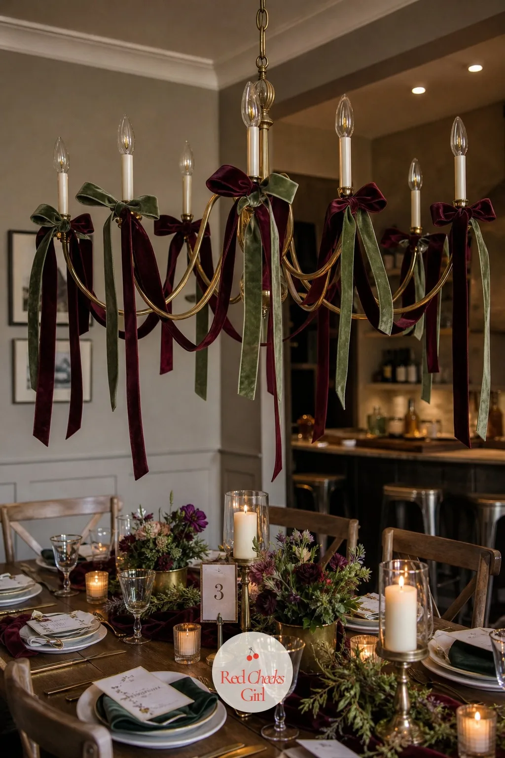 A Ribbon Garland Draped Through the Arms of a Chandelier Above the Table — A chandelier that usually just holds light looks dressed for the evening once ribbon