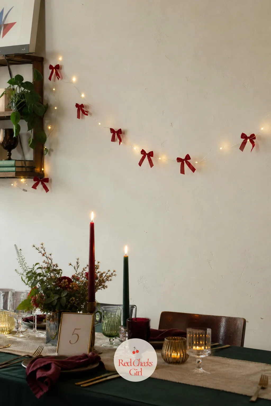 A String of Tiny Red Velvet Bows Clipped Along Fairy Lights Across a Wall — A plain stretch of wall rarely gets decorated on its own, but a loose line of fairy