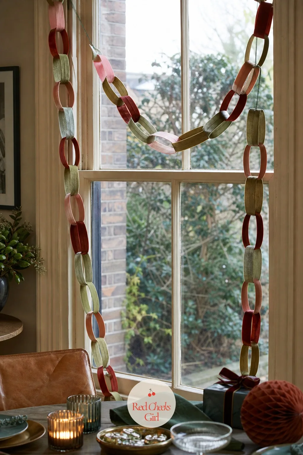Velvet Loop Chain Garland Hung Down a Window Frame — The same chain that dresses the stairs works just as hard hung straight down one side of a window