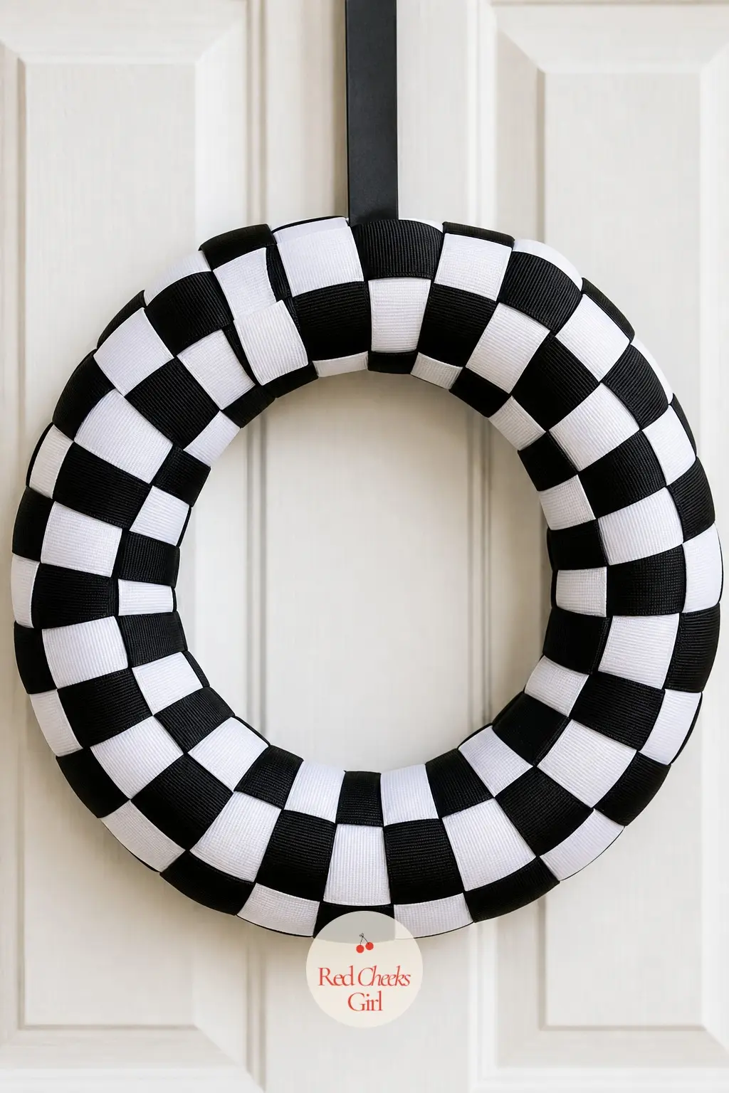 The Checkerboard Grosgrain Wreath for the Retro Diner Party — Two grosgrain ribbons, black and white, weave over and under each other around the ring in a