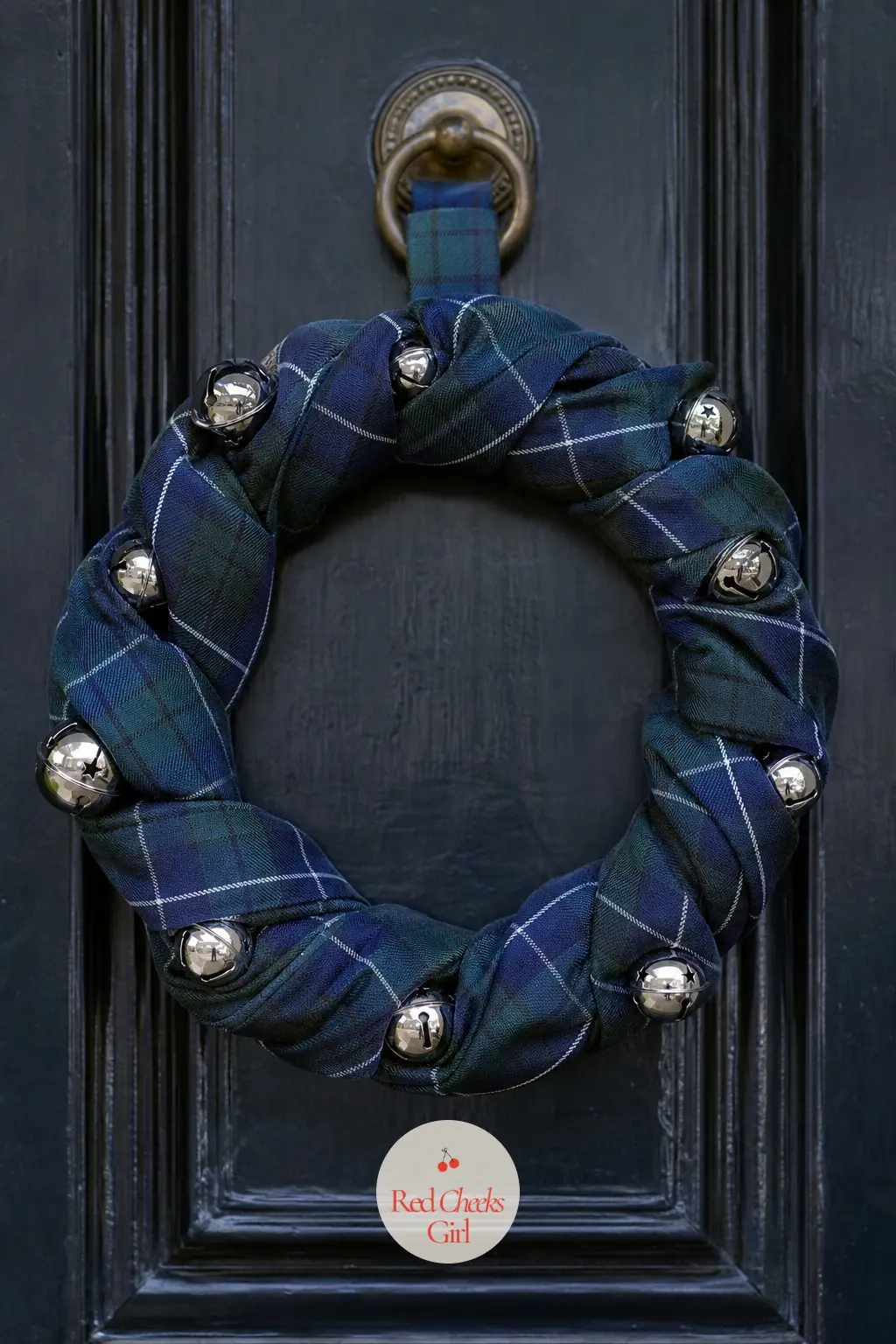 The Navy Tartan Ribbon Twist and Silver Bell Wreath for the Highland Supper Club — A proper tartan, navy ground with a thin red and gold overcheck, twists