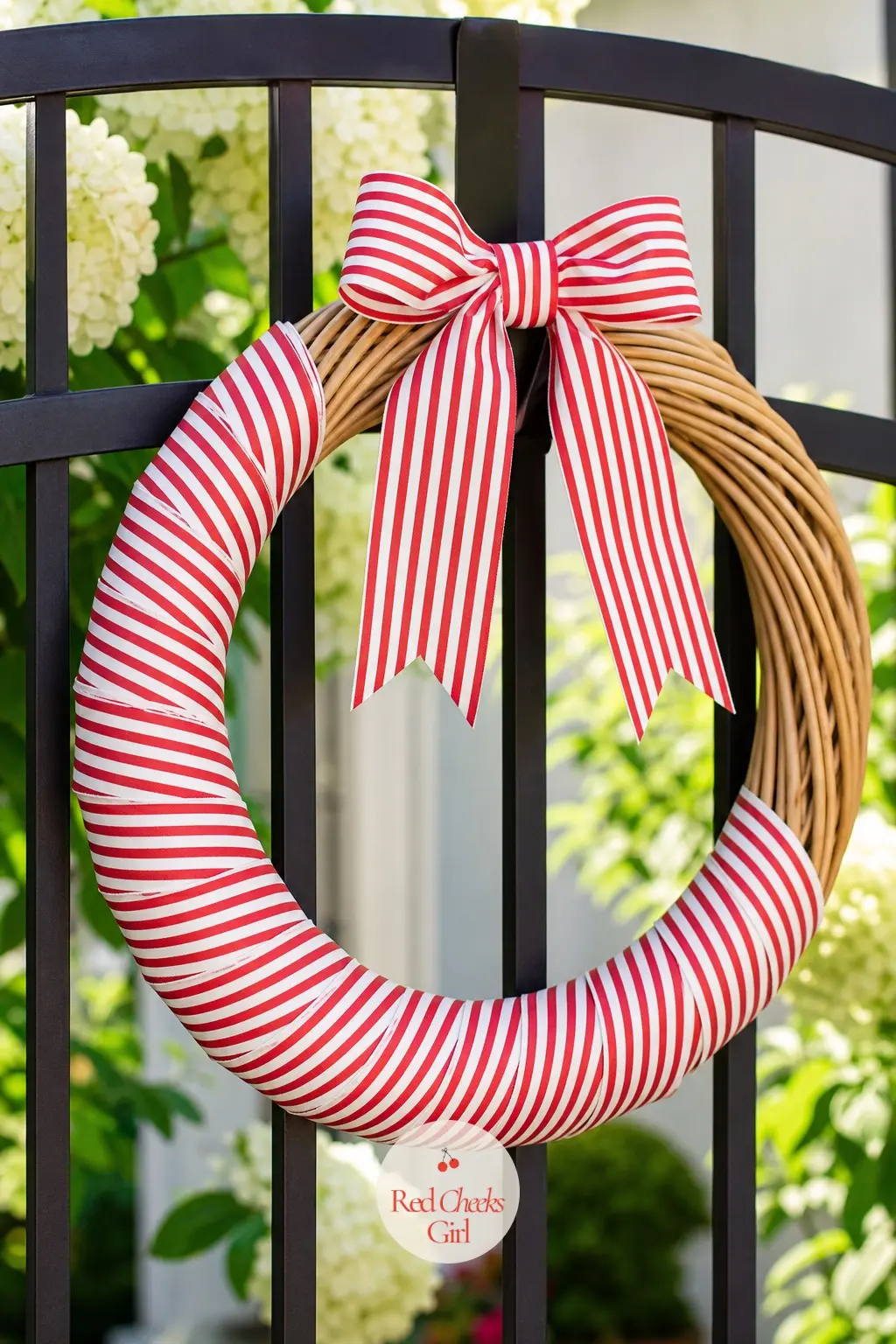 The Striped Grosgrain and Rattan Wreath for the Summer Patio — A woven rattan ring does most of the work here, left bare on one side so the wood grain shows