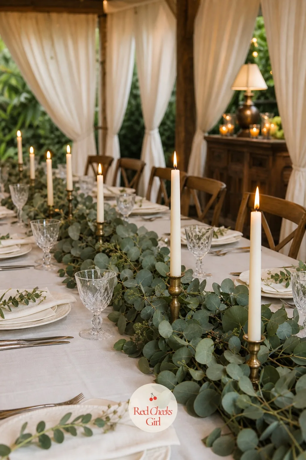 Eucalyptus Garland Runner with Taper Candles — A garland down the table does the work of flowers for a fraction of the cost, since eucalyptus is sold by the