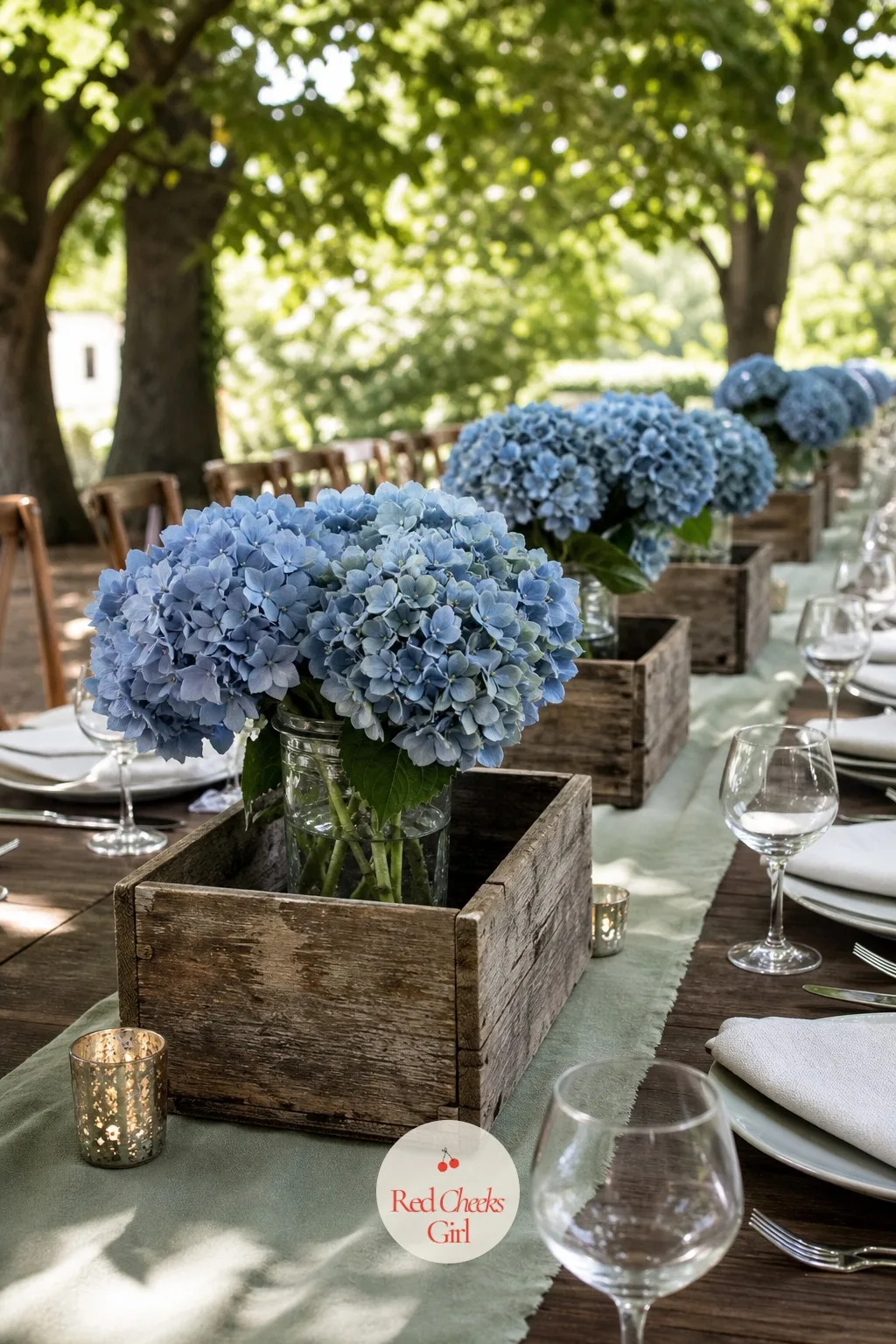 Hydrangeas in Weathered Wood Crates — One hydrangea head fills more space than six roses, which makes this the centerpiece for a bride who wants full tables