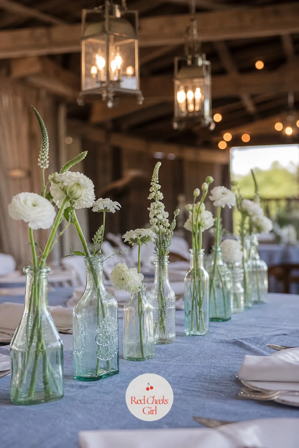 Vintage Bottles in a Row — One tall arrangement looks grand; a row of mismatched vintage bottles looks collected over years, which is the whole appeal here.