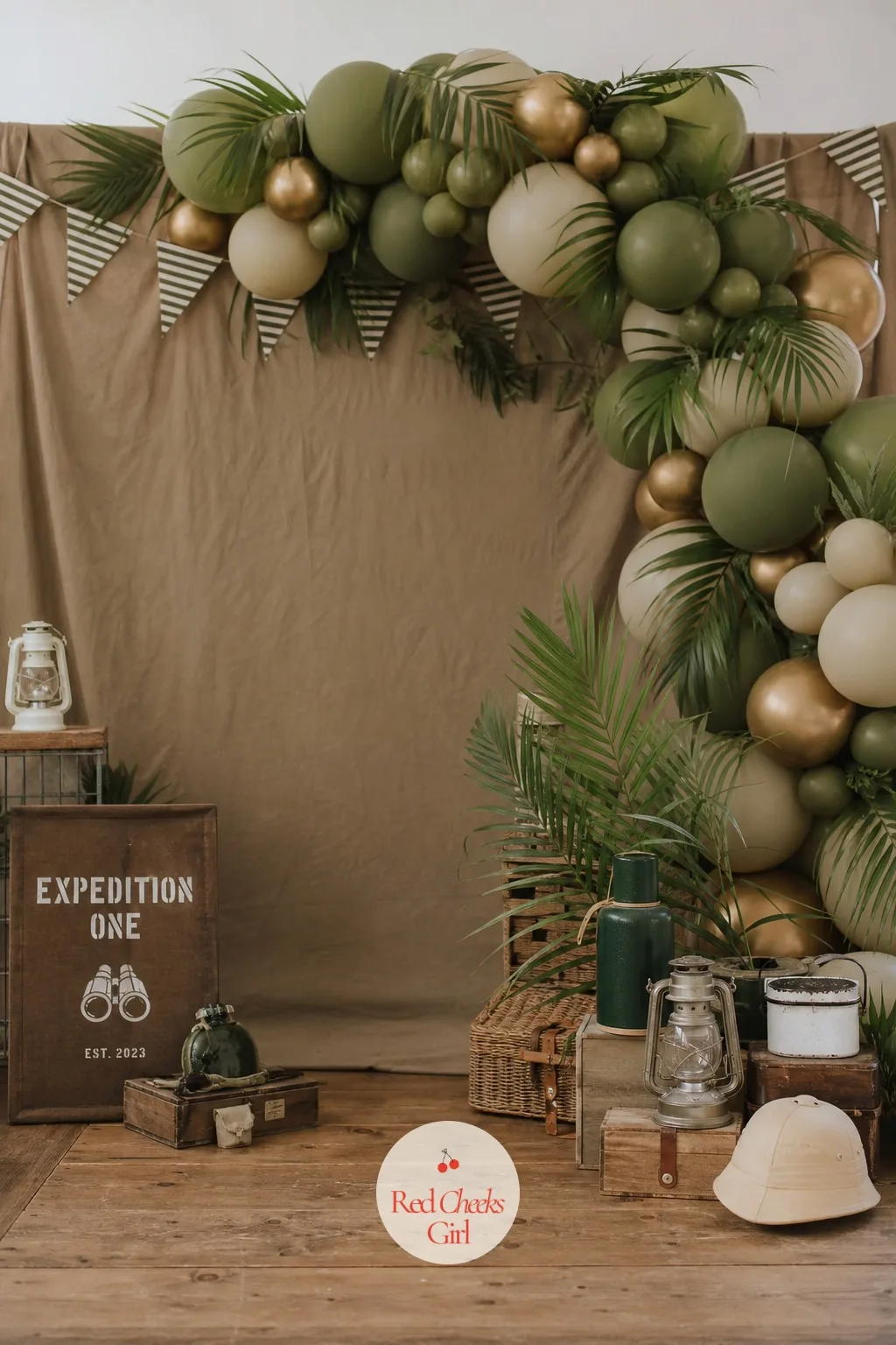 Expedition Backdrop With Balloons and Palm Leaves — A bare wall says nothing about the afternoon ahead, and a single balloon arch in nursery pastels says