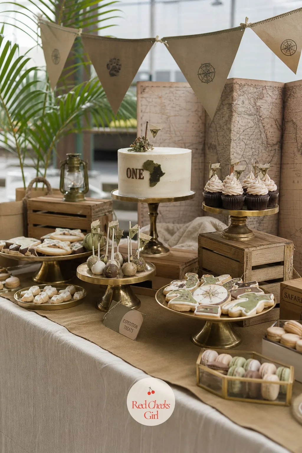 Expedition Dessert Table — A flat table of identical cupcakes photographs as a buffet line, not a celebration. Safari first birthday party