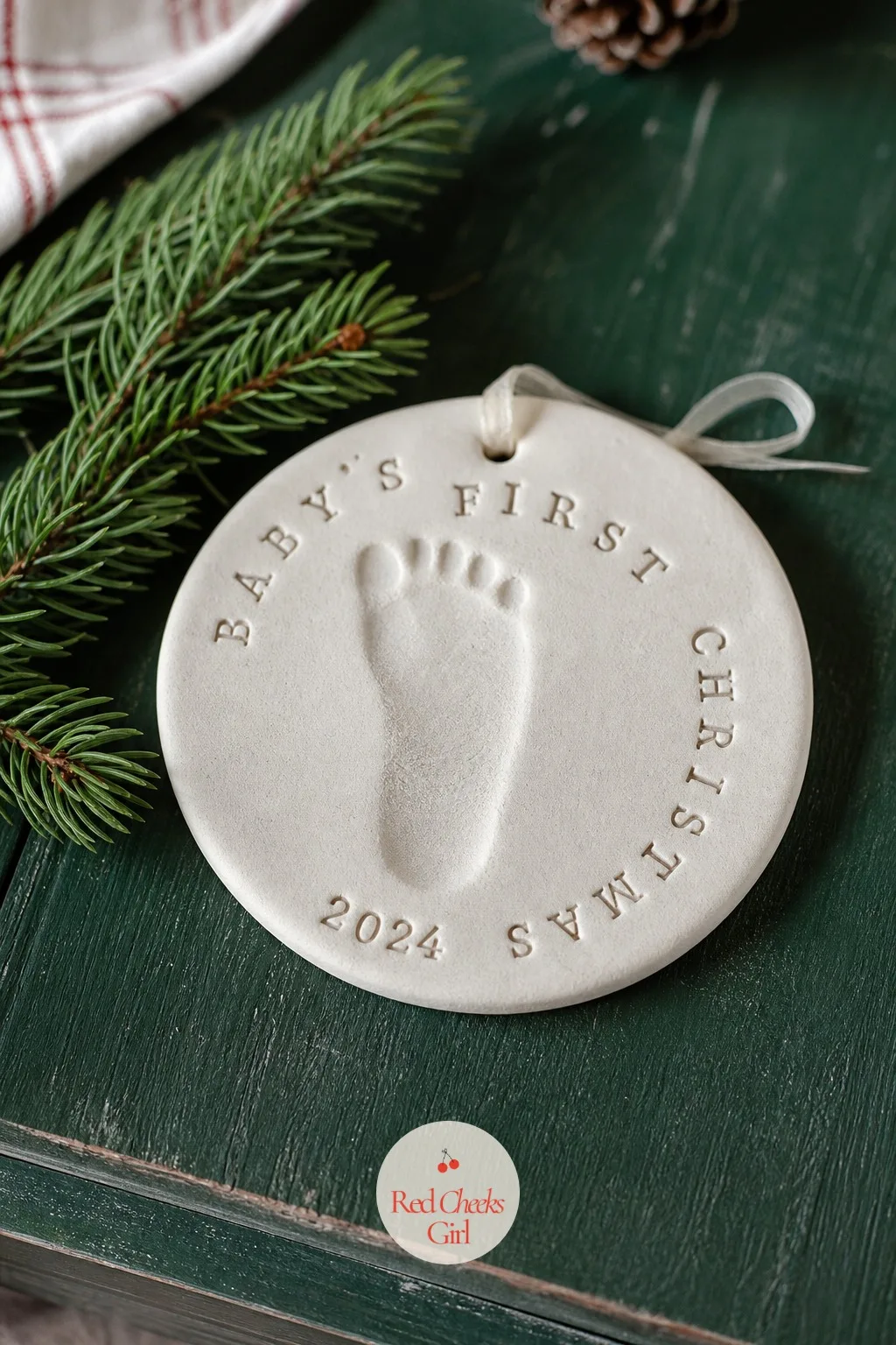 Baby's First Christmas Footprint Disc — A plain ivory disc feels like nothing until you press a tiny foot into the soft dough and watch it become the one