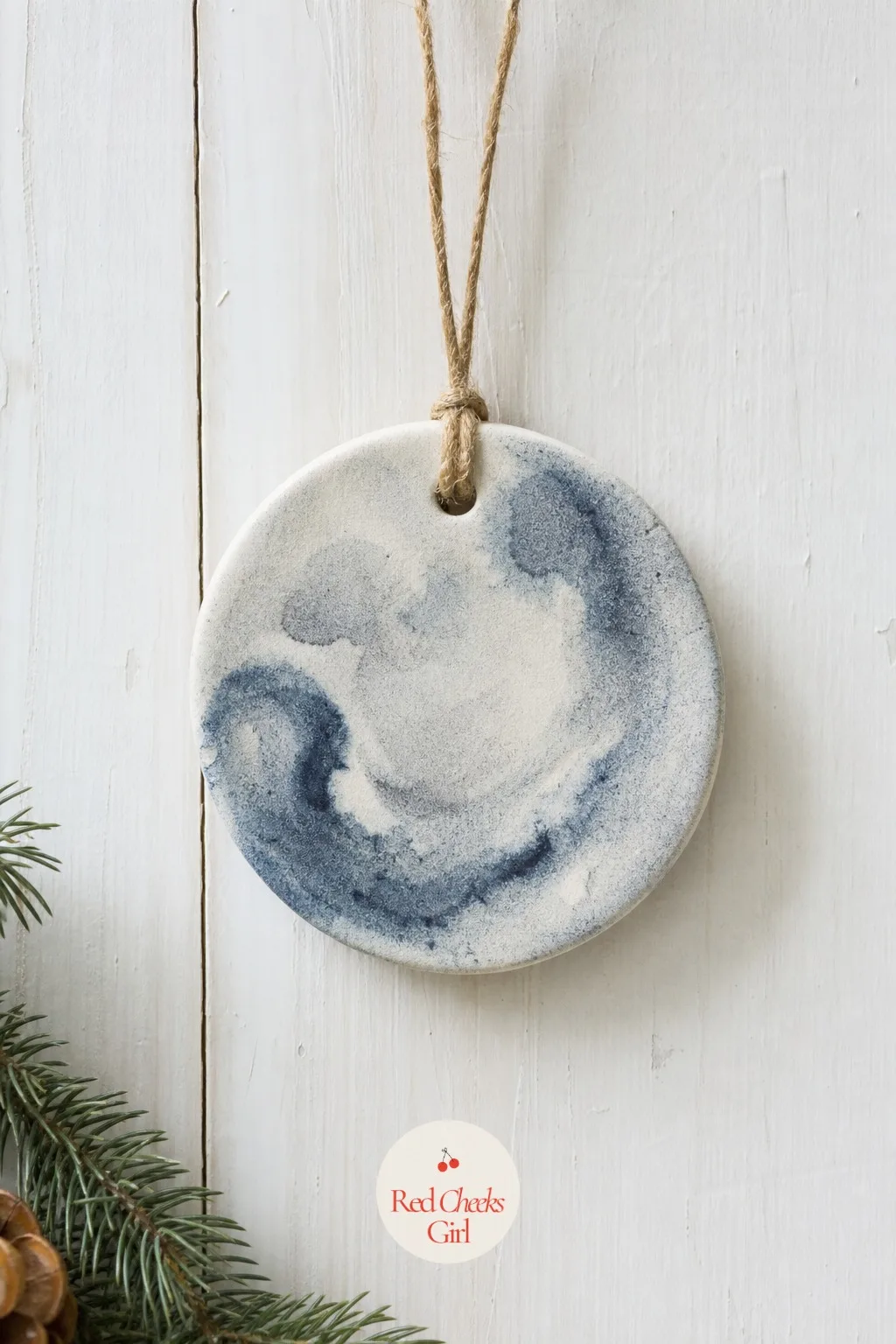 Watercolor Wash Ornaments — Thin acrylic paint down with water until it behaves like ink, then let it bleed across a plain dough disc instead of controlling