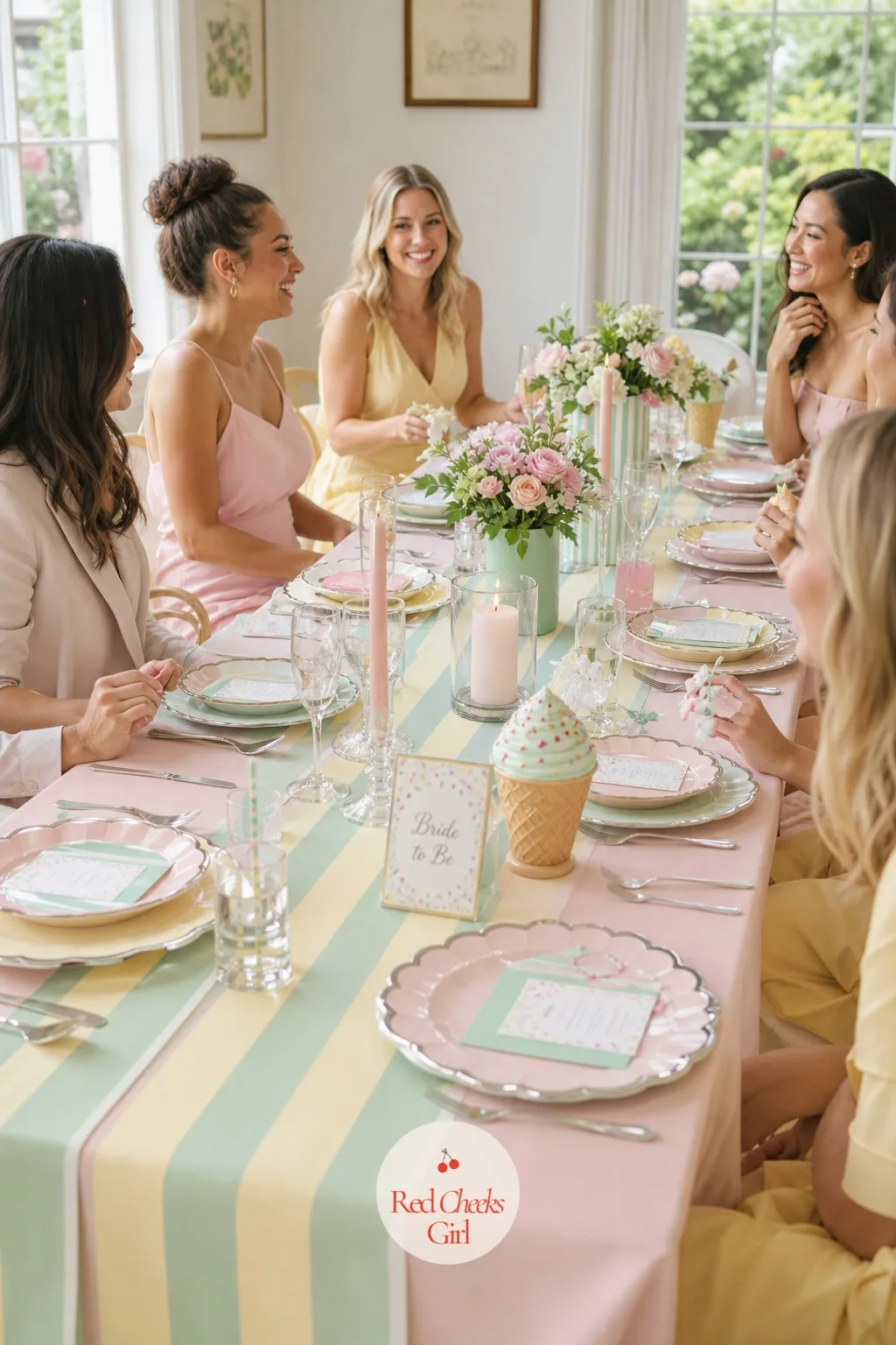 Striped Parlor Tablescape — The guest table should not just borrow the cart's colours, it should wear the stripe directly: a blush pink tablecloth as the base