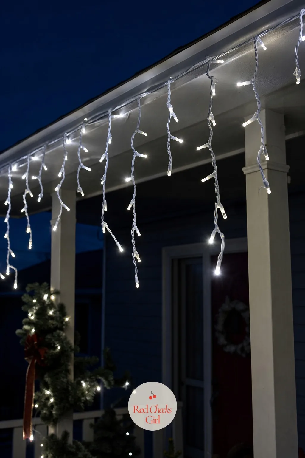 Icicle Lights Under a Shallow Porch Roof — If the full roofline feels like too much commitment, icicle lights under just the porch eave give almost the same