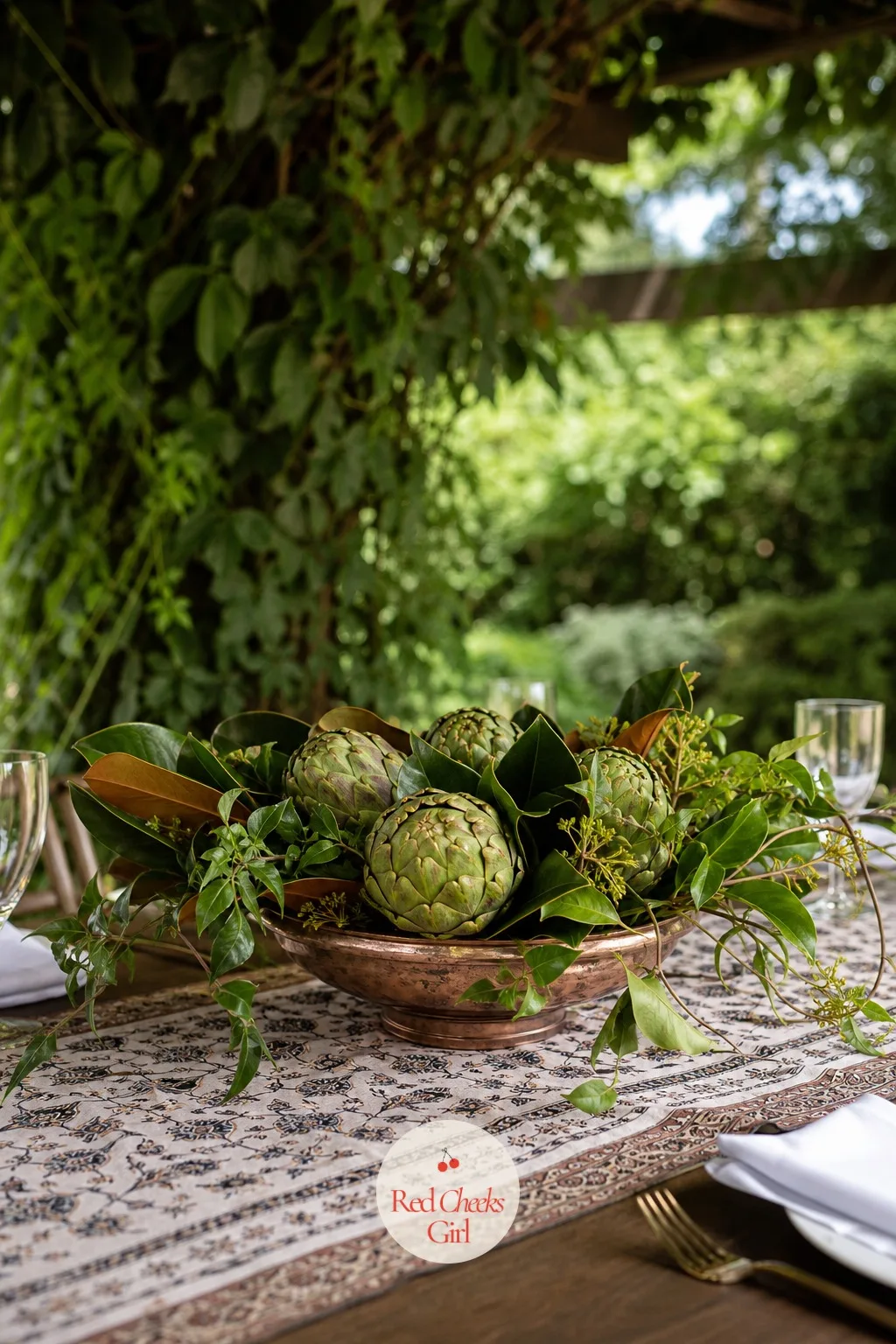 Artichokes and Greenery in a Low Bowl — An artichoke has a sculptural, almost architectural shape that most flowers do not, and a bowl of them looks striking