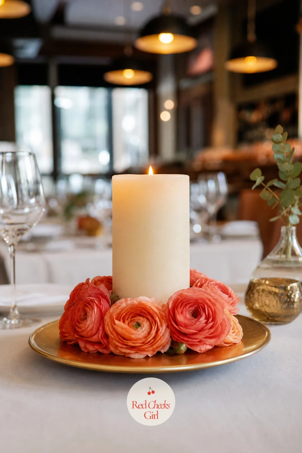 Pillar Candles Ringed With Ranunculus — A pillar candle alone can look a little bare on a dressed table, so give it a ring of flowers at the base instead of a
