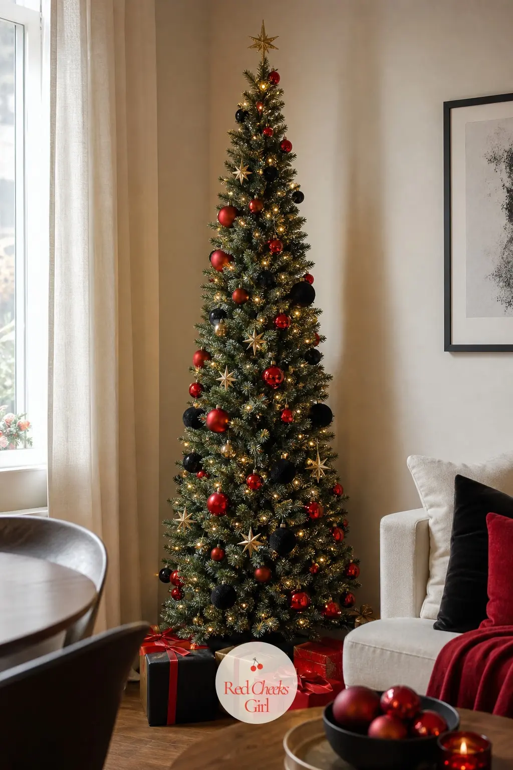 A Slim Pencil Tree in Scarlet and Black — A classic green artificial slim pencil tree, dressed hard against type with scarlet glass and black velvet rather