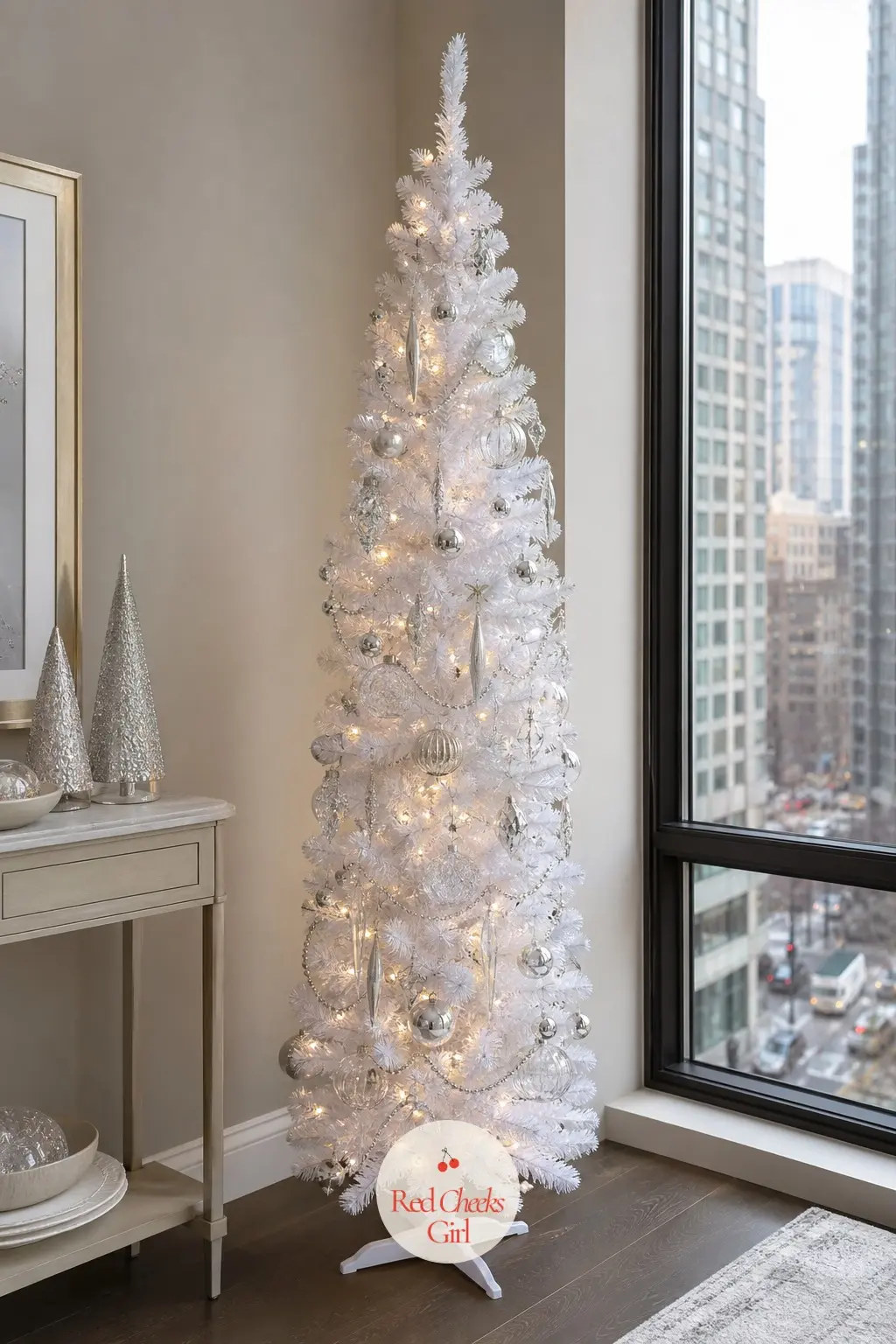 A Slim White Pencil Tree in Silver and Glass — An unflocked white slim pencil tree, the plain PVC kind, which gives it a cleaner line than the flocked version