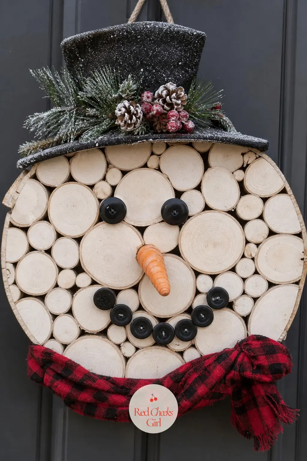 The Birch Slice Face Snowman Wreath — Stack three birch wood slices from largest to smallest around a wire frame and the pale, striated wood does most of the