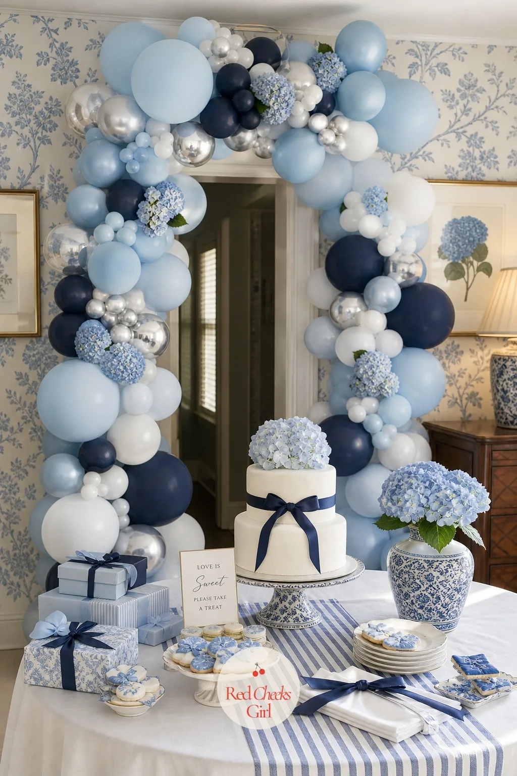The Blue Balloon Arch — The arch is the first thing a camera finds, framed over the dessert table or a doorway, never standing alone against a bare wall.