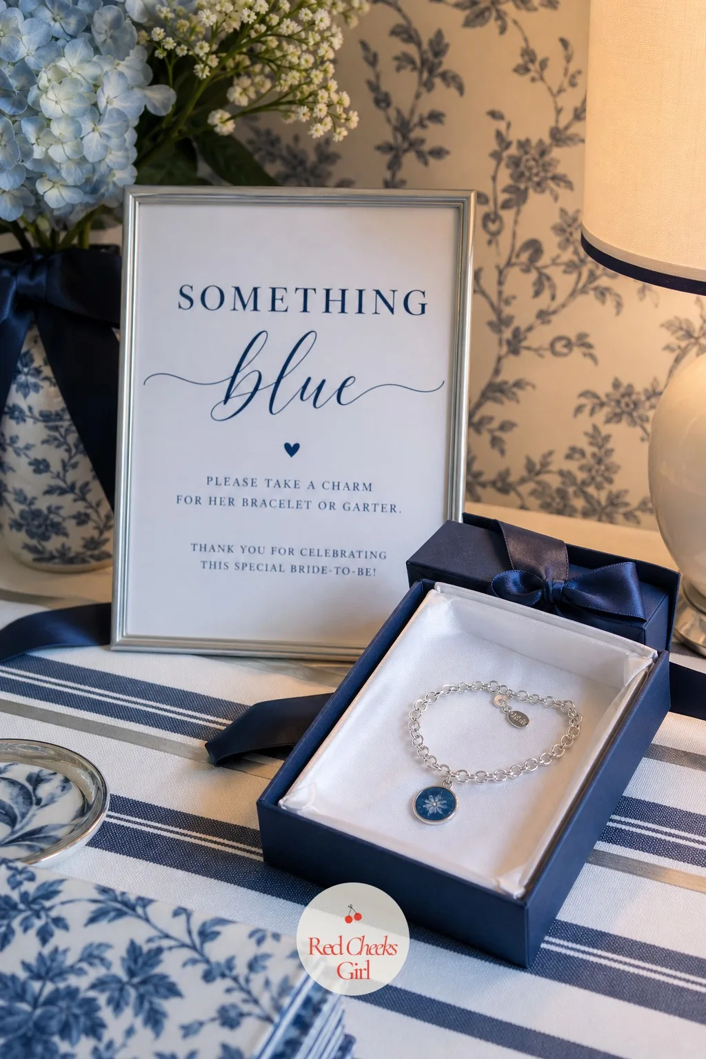 A Blue Charm for Her Garter or Bracelet — Presented near the end of the party rather than among the regular gifts, one small blue charm or ribbon the bride can