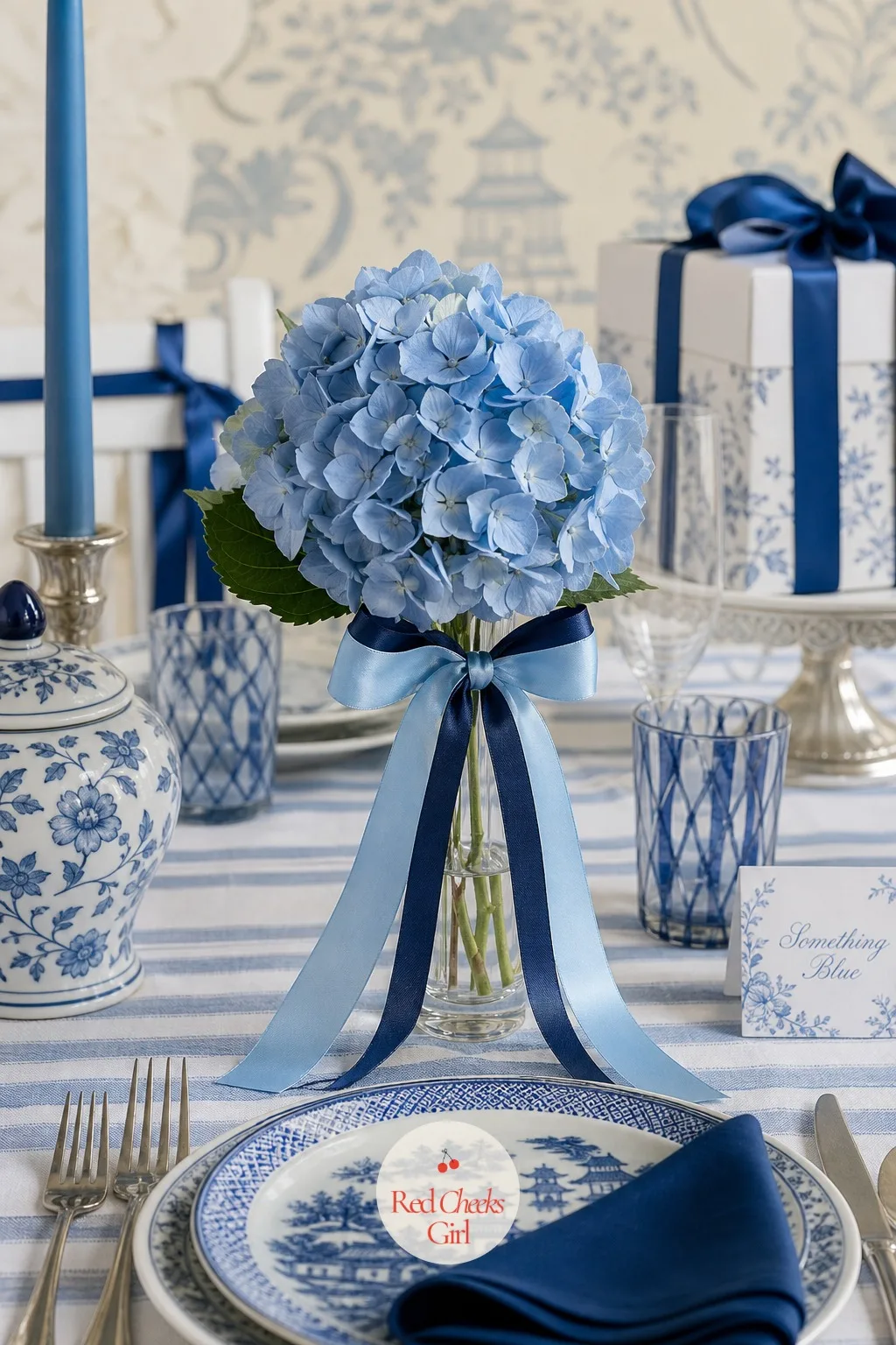 The Blue Ribbon Bouquet — Set at the bride's own place at the table, a small bouquet built almost entirely from ribbon rather than flowers, standing in a