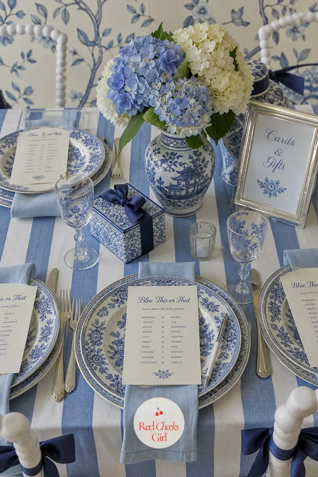 Blue This or That Guessing Game — Set at each place setting, a small card in navy ink asks guests to choose between two options about the bride and groom, from