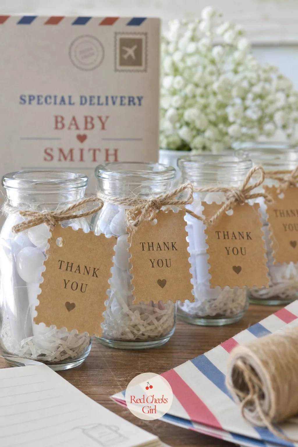 Postage Stamp Thank You Tags — For the pizza take, swap the passport stamp for a postage stamp, perforated edge and all, tied with plain twine to the neck of