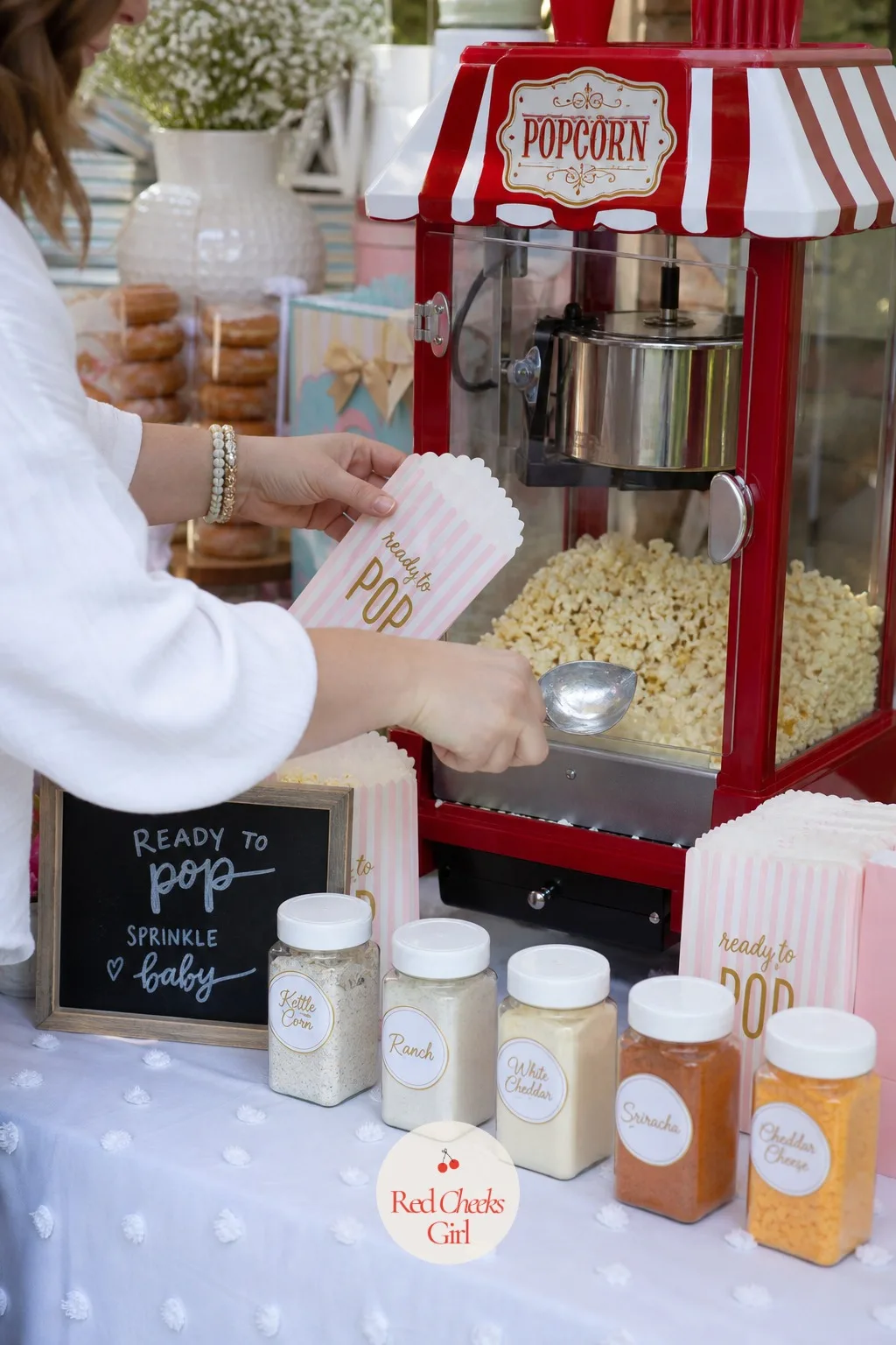 Ready to Pop Popcorn Station — The pun is tired everywhere else, but on a snack table it still gets a genuine laugh, and popcorn is the one treat every age at