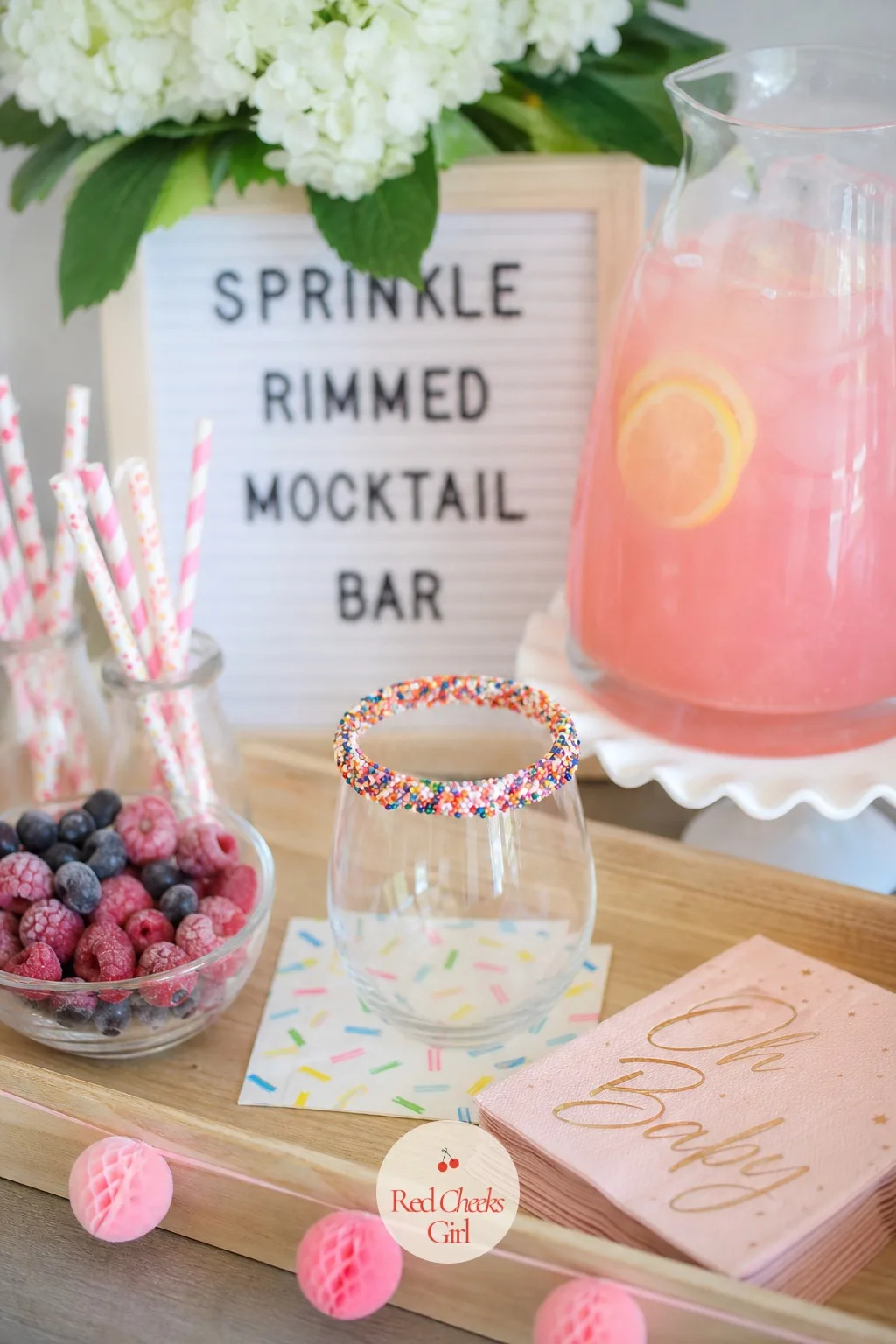 Sprinkle-Rimmed Mocktail Bar — The guest of honour is off wine, which does not mean the drinks have to be boring. Sprinkle baby shower ideas