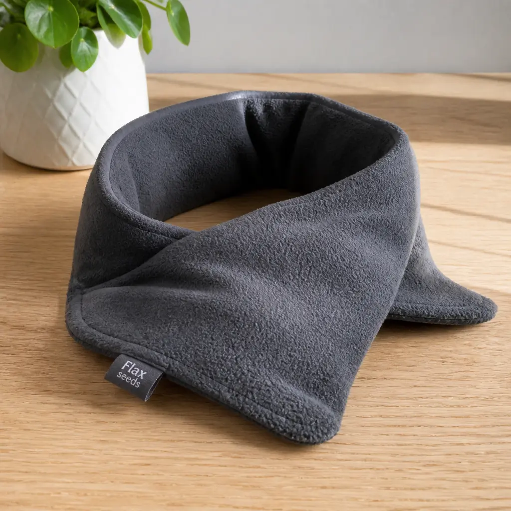 Heated Neck Wrap — Six hours on her feet lands somewhere in her shoulders by Thursday, and this is the thing that gets microwaved and draped on without a