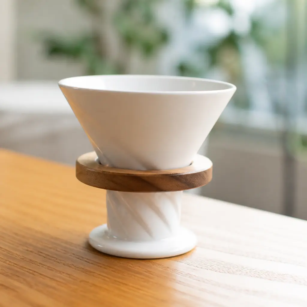 Pour Over Dripper — She will reach for this the second the carpool line goes quiet: a small ceramic dripper that turns the staff room instant into something