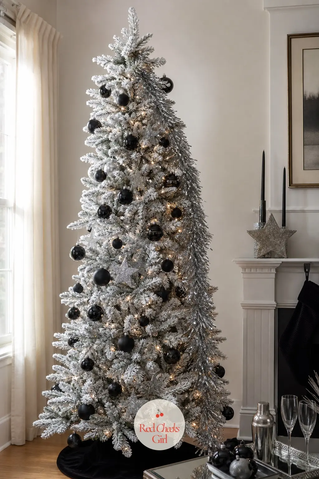 The Flocked Black-Tie Tree — A flocked white artificial tree, floor to ceiling, with black glass and silver tinsel cascading down it like a dress with sequins