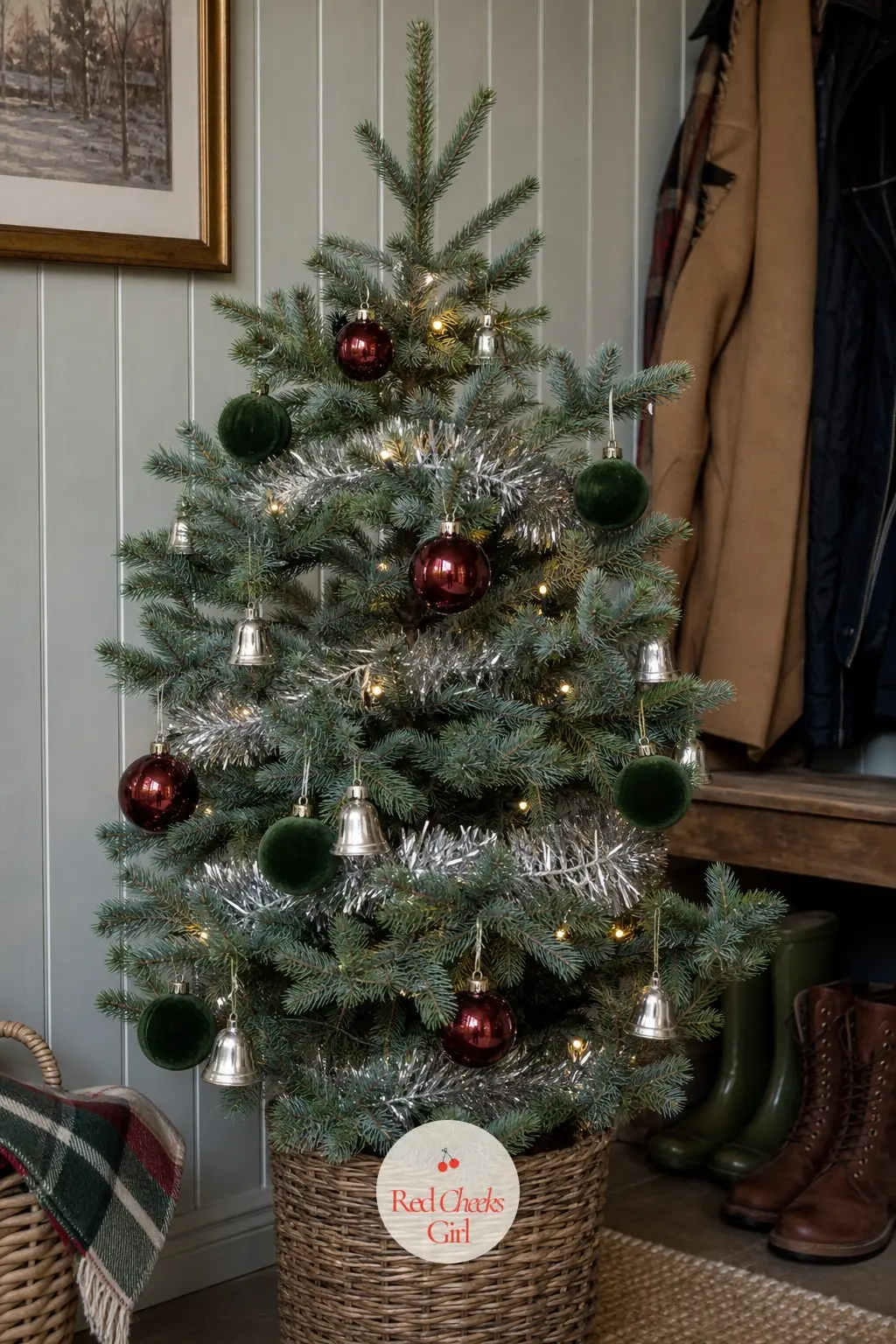 The Garnet and Holly Potted Fir — A small, real potted fir by the front door, dressed in loose silver tinsel with garnet red and holly green glass for a more