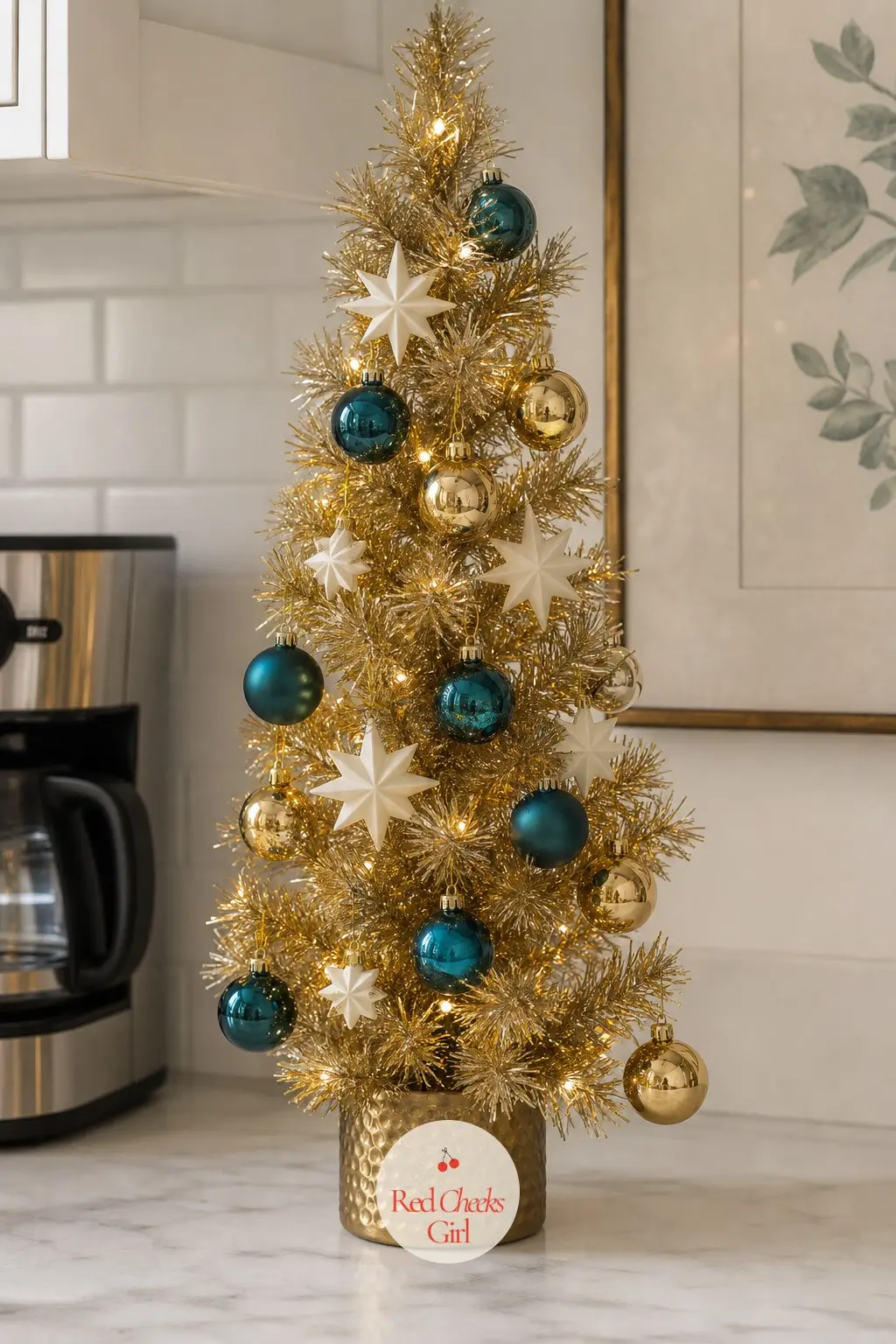 The Gold and Teal Mini Pencil — A small artificial pencil tree for a kitchen counter, pairing gold with an unexpected teal rather than the usual green or red.