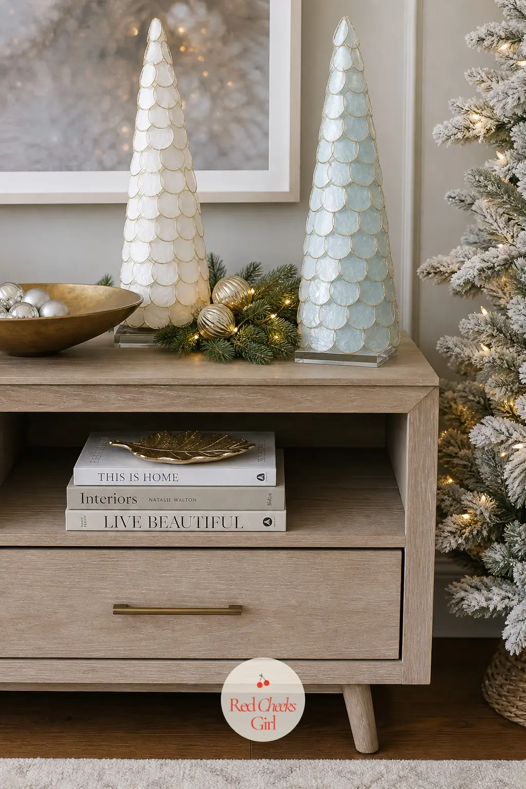 A Pair of Capiz Shell Trees in Pearl and Ice Blue Either Side of the Stand — Two cone shaped trees built from layered capiz shell discs, one in pearl white and
