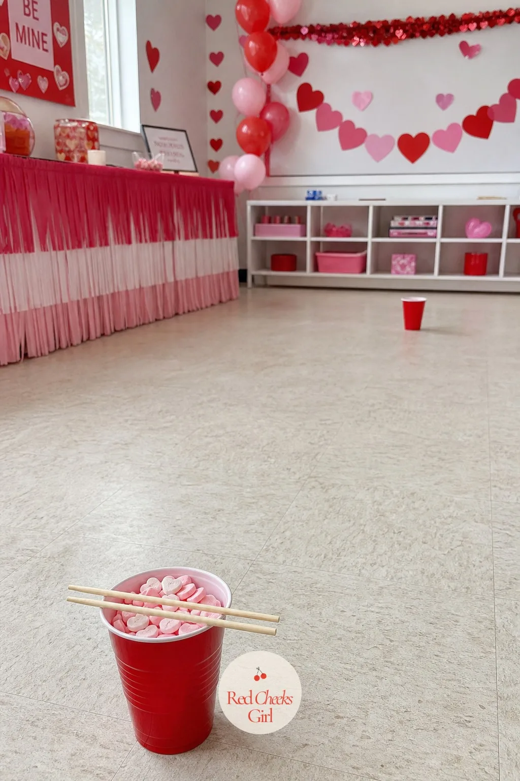 Conversation Heart Chopstick Relay — She will not believe how hard this looks until she watches a nine-year-old drop a conversation heart for the fourth time