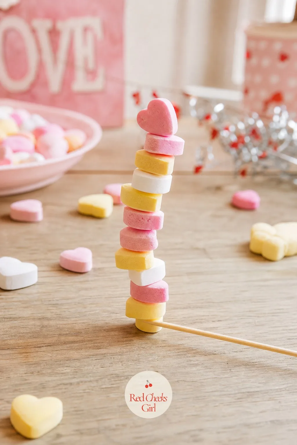 Heart Balance Stack — Nobody believes stacking ten little candies on a stick is hard until they try holding the stick only with their teeth. Valentine party