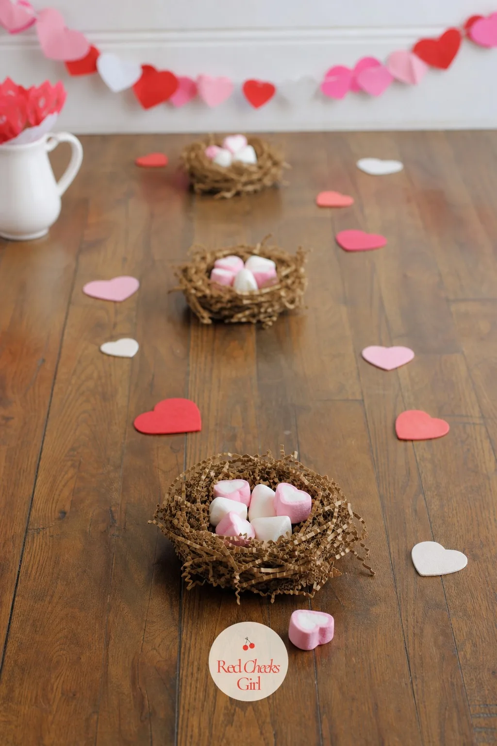 Love Birds Nest Toss — Three little nests lined up at different distances turn a handful of marshmallows into a surprisingly tense aiming game. Valentine party