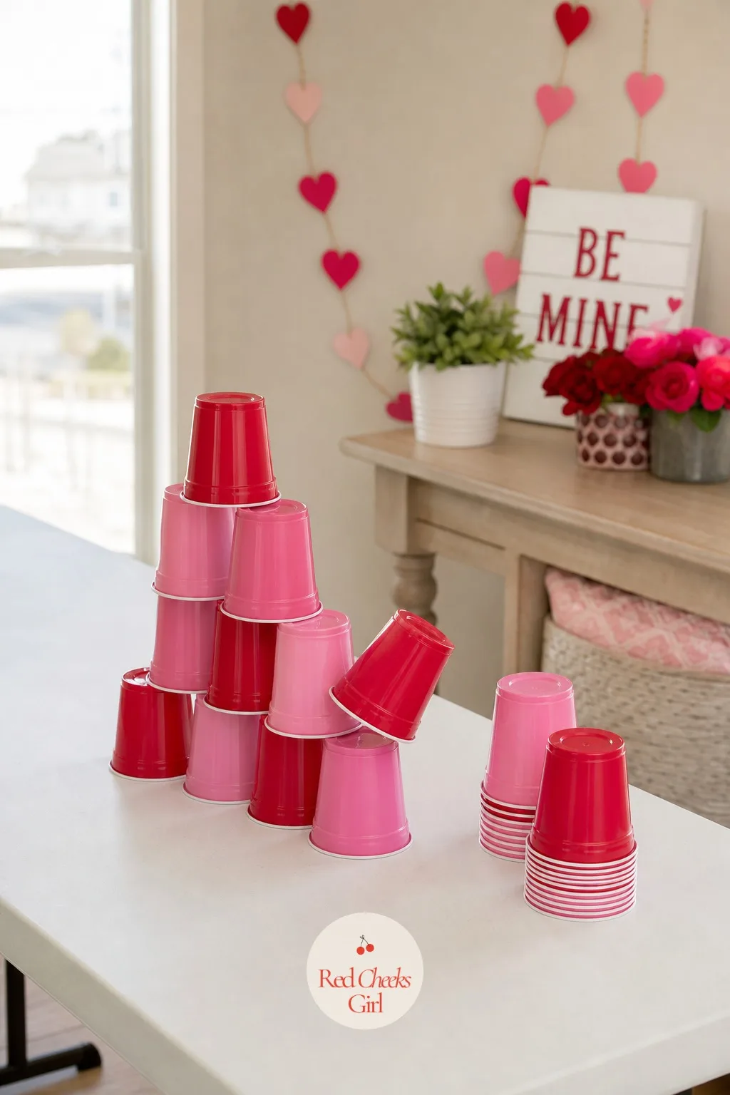 Tower of Love Cup Relay — A pyramid of cups takes concentration to build and about two seconds to knock down, which is why teams get competitive fast over who