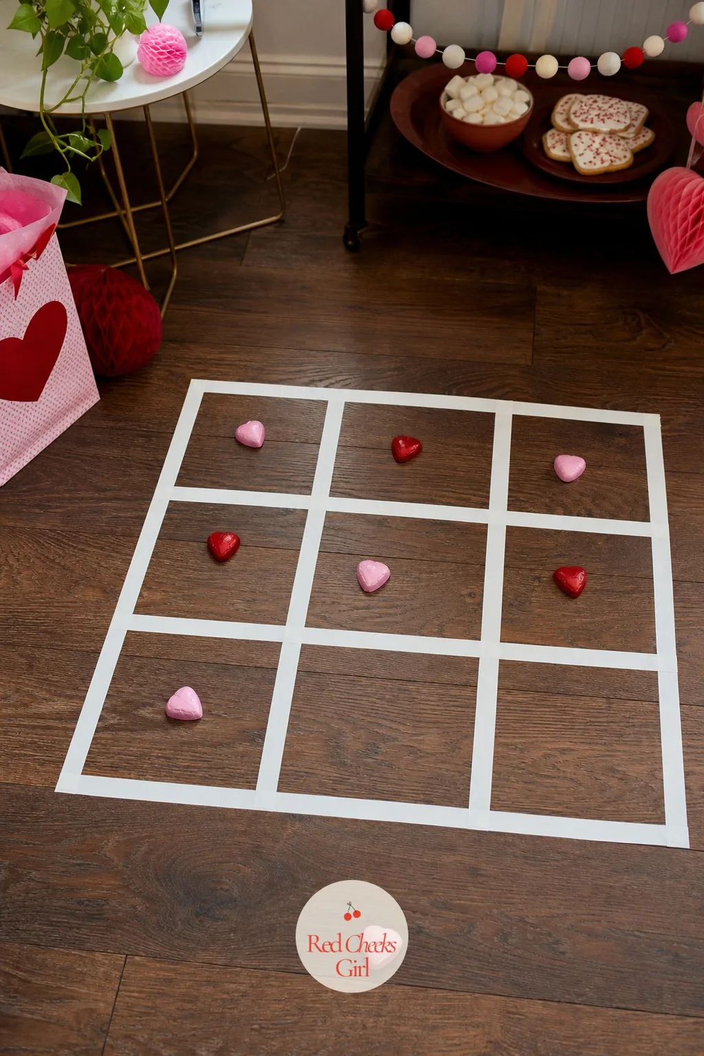 X&O Tic Tac Toe — A grid of tape on the floor does not look like much until two players are lobbing candy hearts at it, aiming for one square and usually