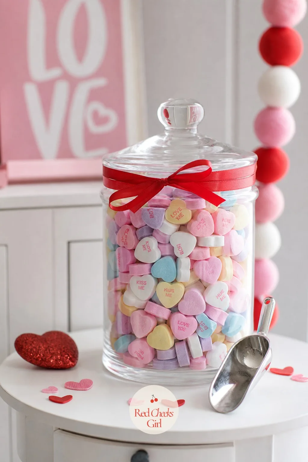 Conversation Heart Jar — Every surface at a party needs one thing guests can pick up without asking permission, and a jar of candy hearts is exactly that.