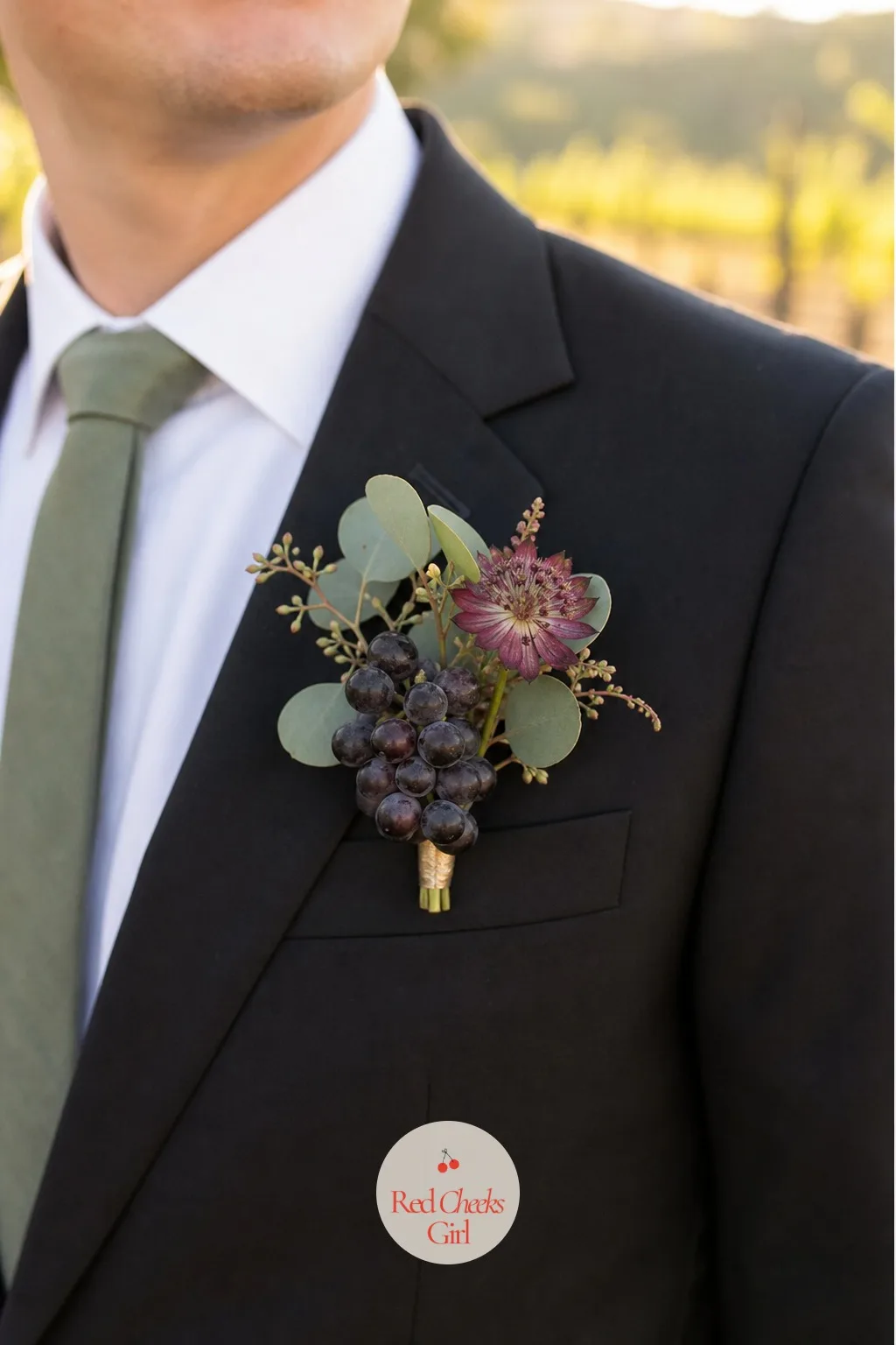 The Groom's Boutonniere with a Grape Cluster — Pinned to the lapel, the groom's boutonniere is the smallest flower in the whole wedding and the one place the