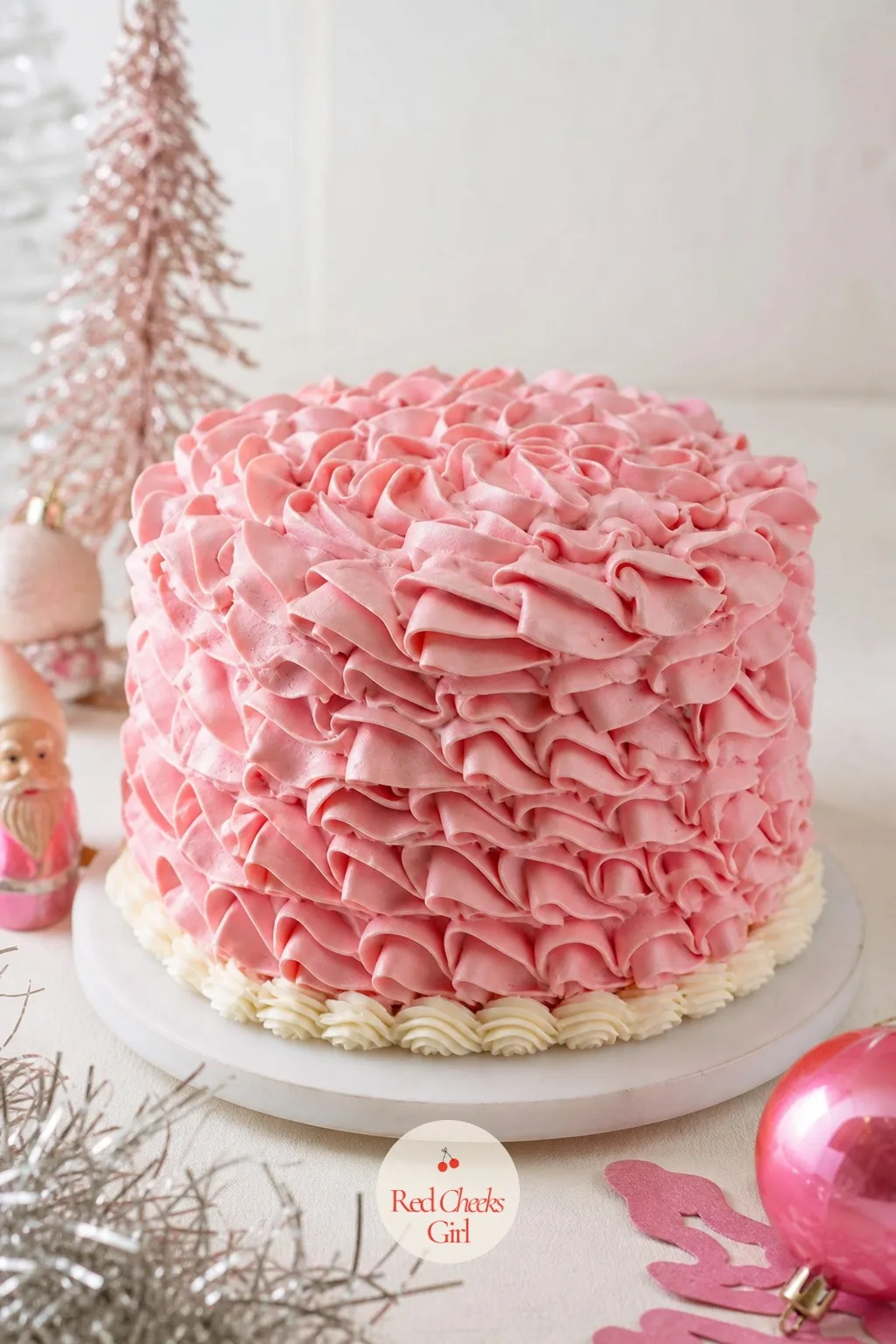 Pink Vintage Christmas Cake — Not every guest wants fire engine red on the table, and a blush cake still says Christmas the moment it sits next to a few sprigs