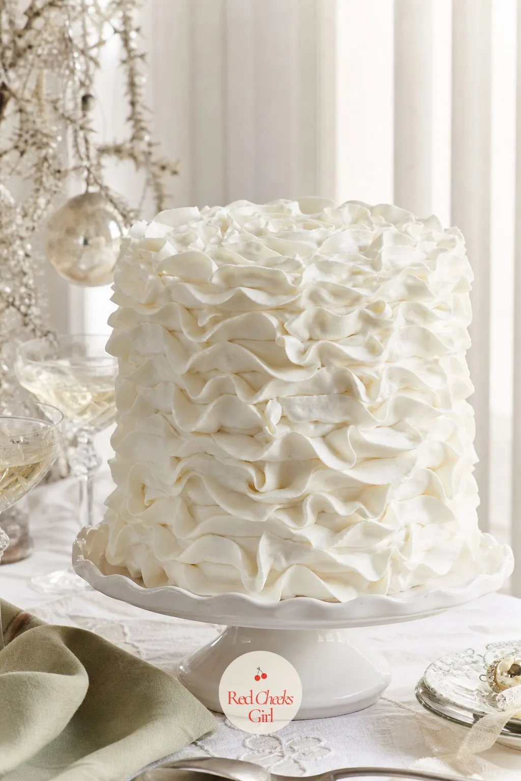 Snowy White Ruffle Cake — White on white has no colour to hide behind, so every ruffle has to be even, which makes this the cake that actually teaches you the