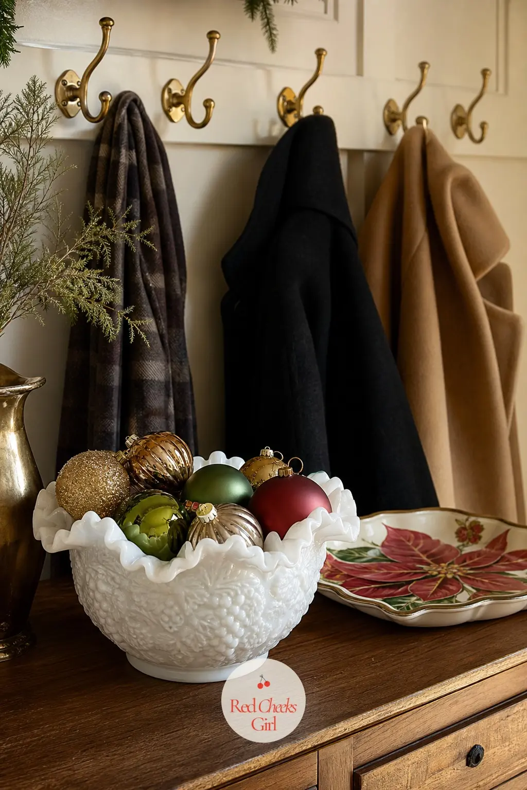 The Entryway, a Milk Glass Bowl and Brass Hooks — Just inside the door, a small table holds a milk glass bowl filled with spare ornaments for anyone who wants