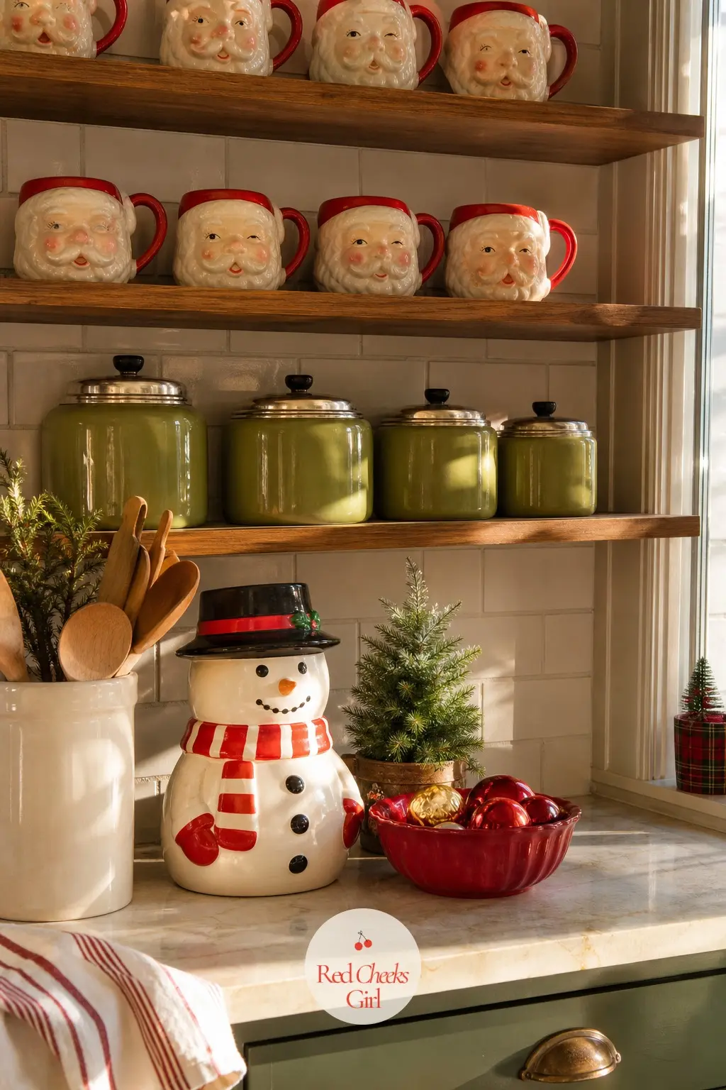 The Kitchen Counter, Santa Mugs and a Cookie Jar — Open shelves hold a row of six Santa mugs facing out and a cookie jar shaped like a snowman or a poinsettia