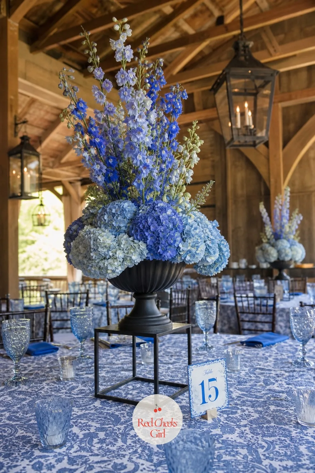 Delphinium and Hydrangea on Iron Urns — Blue is the hardest colour to get right on a wedding table, too much of it goes cold. Wedding centerpieces
