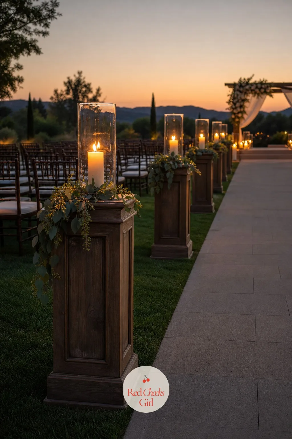 Lantern-Lined Aisle — An aisle with nothing along its edges disappears the second the sun drops, which matters if the ceremony runs anywhere near dusk. Wedding